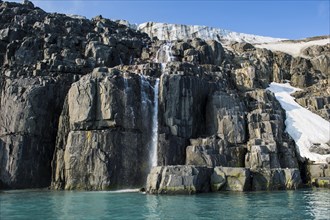 Waterfall in a glacier on Alkefjellet