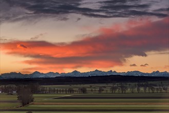 Sunrise over landscape with Alps