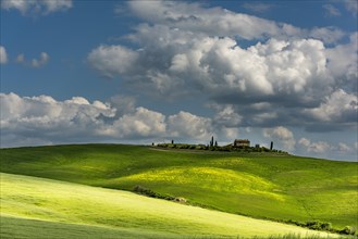 Tuscan landscape with farm on hill