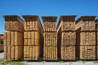 Stacked wooden slats and boards in a sawmill