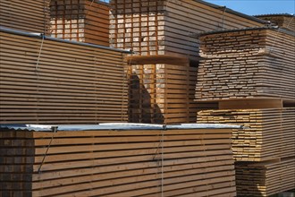Stacked wooden slats and boards in a sawmill