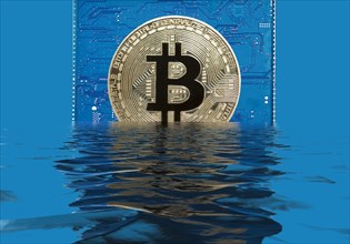 Bitcoin on a blue circuit board sinks into water