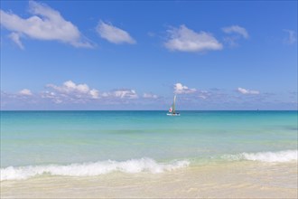 Sailboat in turquoise water