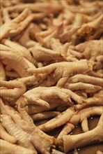 Chicken feet for sale on the city market