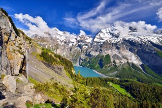 Oeschinen Lake with Bernese Alps with Bluemlisalp and mountain Doldenhorn