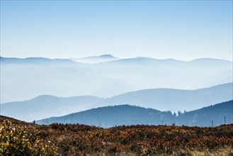 Staggered mountain ranges in the haze