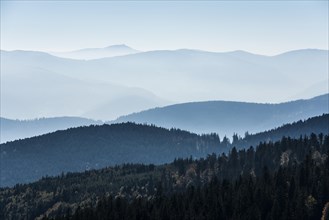 Staggered mountain ranges in the haze