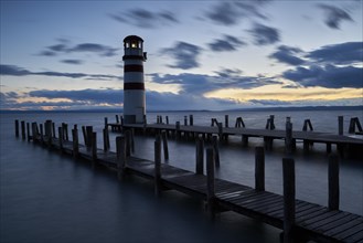 Lighthouse at the footbridge at dusk