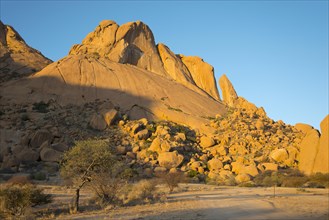 A Spitzkoppe peak in evening light in Erongo Region