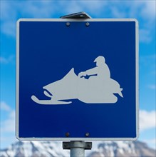 Snow mobile warning road signpost