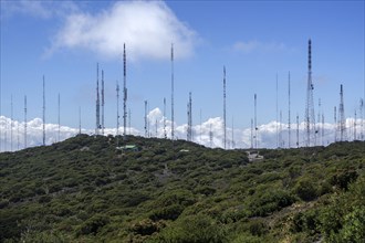 Many transmitter masts on mountain ridges