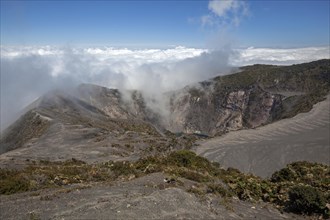 Main crater Irazu Volcano with rising clouds