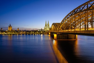Church St Martins and Cologne Cathedral with Hohenzollern Bridge over the Rhine