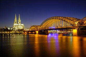 Cologne Cathedral with Hohenzollern Bridge over the Rhine