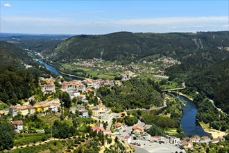 View from the viewpoint Penedo de Castro to the city Penacova at the river Mondego