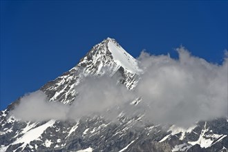 Weisshorn summit with snow and clouds