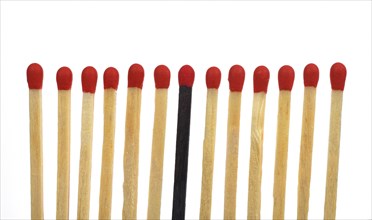 A black match among several bright matches