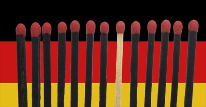 A bright match among several black matches