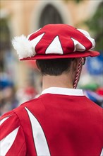 Hat red white brimmed red feather headdress knows red jacket with red sleeves white