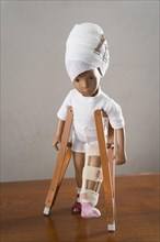 Doll with bandaged head