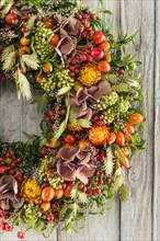 Autumn wreath cutout on wooden wall
