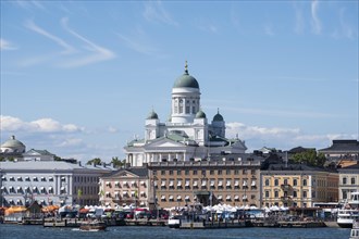 Cathedral of Helsinki behind the houses at the port