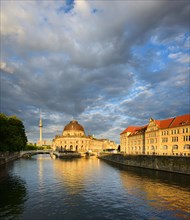 View over the Spree to the Museum Island with the Bodemuseum in the warm evening light