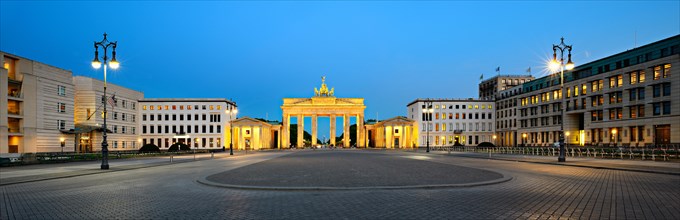 Pariser Platz with illuminated Brandenburg Gate at dawn