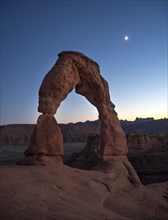 Delicate Arch rock arch Evening sky with moon