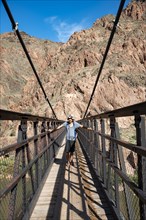 Hiker on the Suspension Bridge Kaibab Suspension Bridge