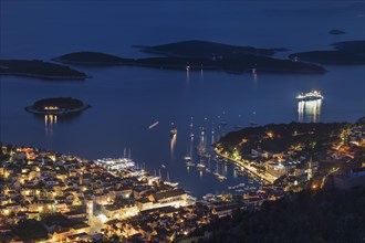 Town view Hvar with harbour and Pakleni islands at night
