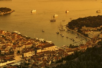 Town view Hvar with harbour at sunset