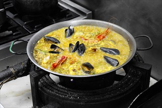 Paella cooking in a pan