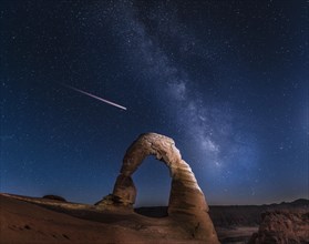 Natural Arch Delicate Arch with Milky Way and shooting star at night