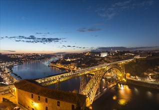 View over Porto with illuminated Ponte Dom Luis I Bridge across River Douro