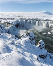 Gooafoss Waterfall in winter with snow and ice