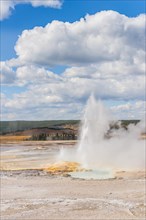 Steaming geyser with water fountain
