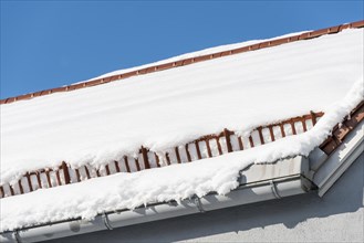 Snow guard on the roof with snow