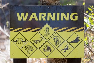 Warning sign displaying dangerous animals
