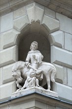Sculpture of St. Martin on a house corner
