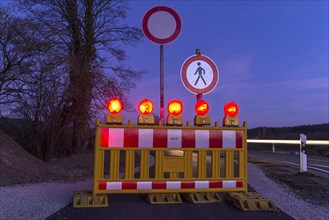 Illuminated road block on bicycle path