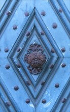Historical doorknob on a blue front door