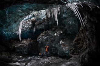Tourists photographing in an ice cave