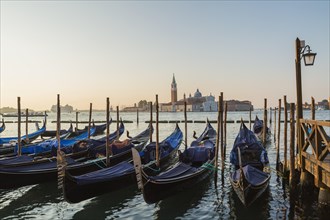 Gondolas in San Marco and Benedictine church of San Giorgio Maggiore on San Giorgio Maggiore island