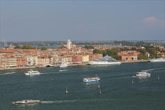 City view with excursion boats and vaporetto in the lagune