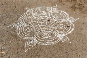 Kolam sand-painting drawn with rice powder