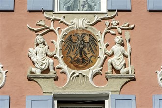 Former bakery with baroque stucco and mural painting with double-headed eagle and pretzel