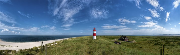 Beach panorama at the elbow with lighthouse