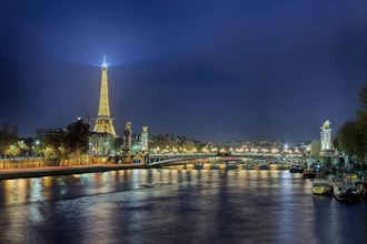 Illuminated Eiffel Tower on the Saine