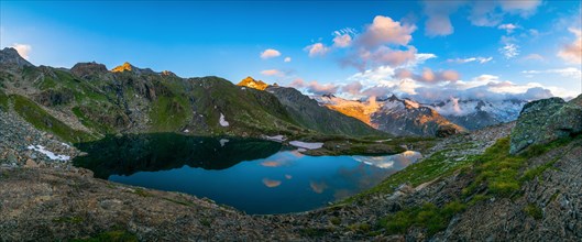 Lake Schwarzsee in the evening light with mountain range